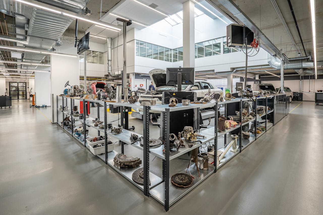 Engine Parts On Shelves In Car Workshop